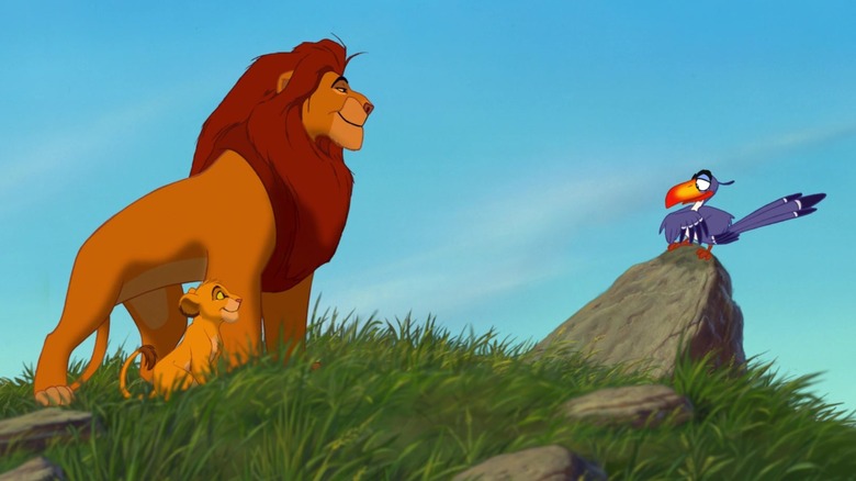 Mufasa and Simba talk to Zazu who is standing on a rock