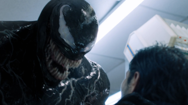 Venom decides whether to eat a bad guy