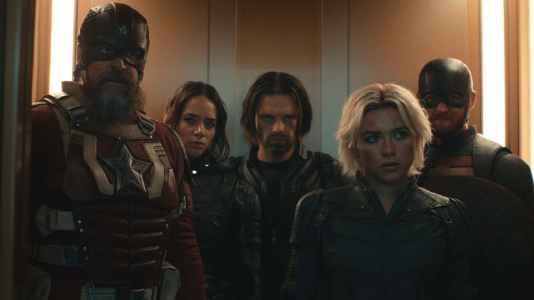 The Thunderbolts standing in an elevator looking grouchy