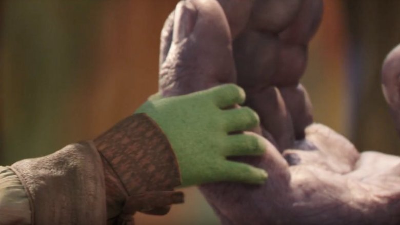 A young Gamora grasping Thanos' hand in Avengers: Infinity War