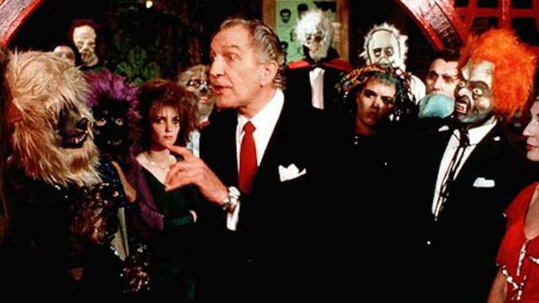 Vincent Price surrounded by party monsters