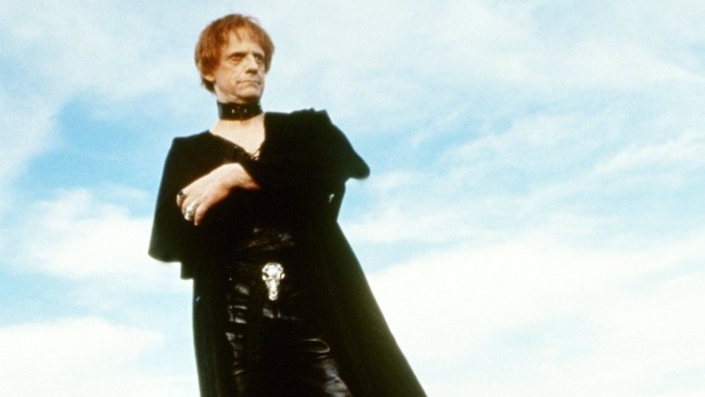 Christopher Lloyd stands in black leather