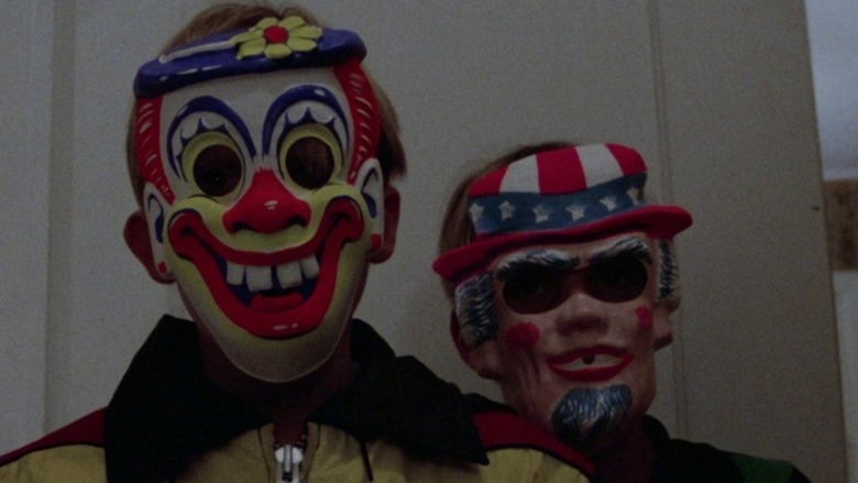 Two kids in Halloween masks