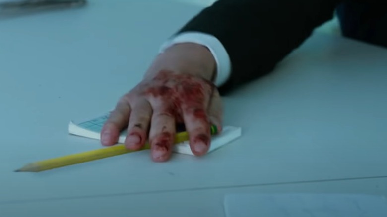 John Wick grabs pencil