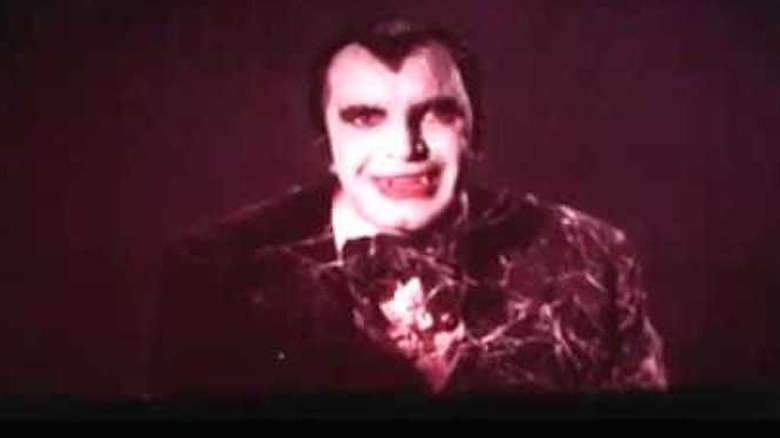 Barry Atwater wears a vampire costume