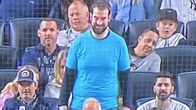 Actor smiles at baseball game