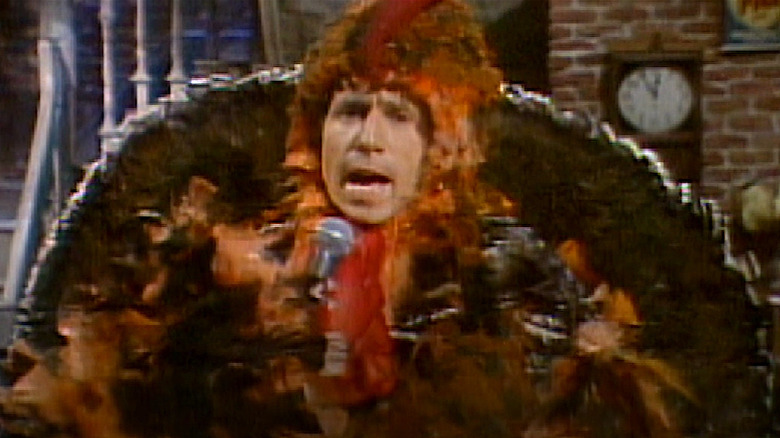 Paul Simon sings in turkey suit