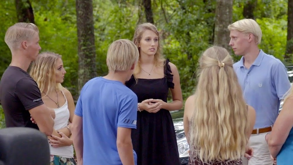 Olivia talking with family members