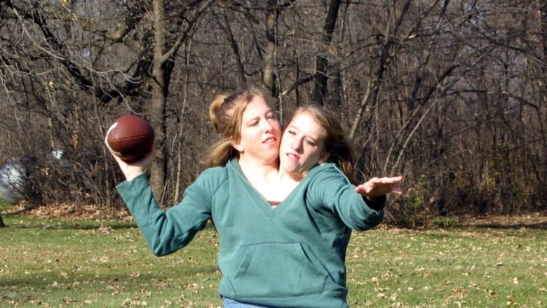 Abigail and Brittany Hensel play football