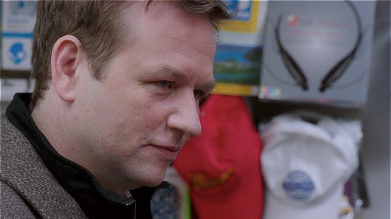 Dallas Roberts glowering