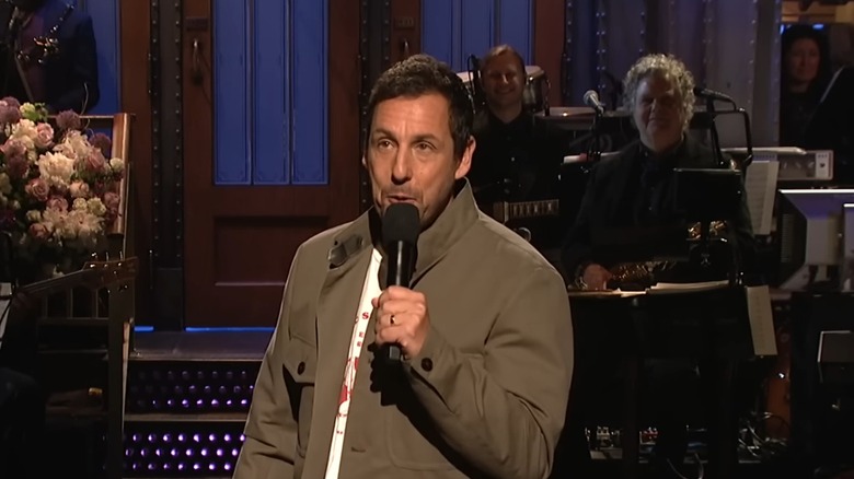 Sandler singing during his SNL monologue