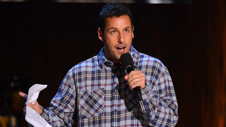 Sandler performing stand-up comedy