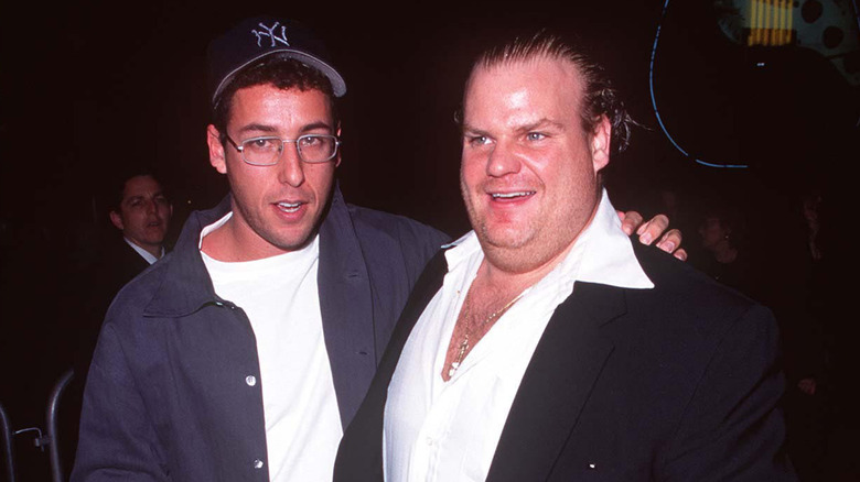 Sandler with arm around Farley