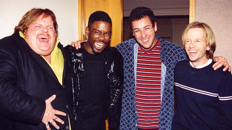 Farley, Rock, Sandler, and Spade smiling 