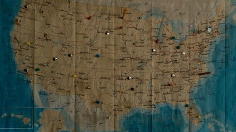 A wall map of the United States with pushpins representing Fromville residents' origin points