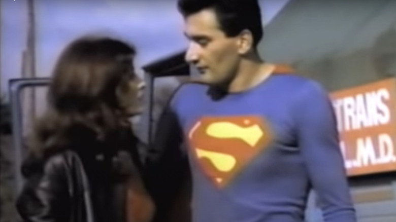 Superman talking to woman 