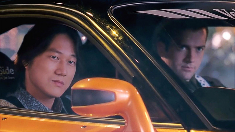 Han driving his Mazda RX-7 with Sean in the passenger seat