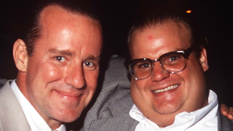 Chris Farley posing with Phil Hartman