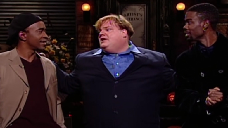 Farley during his monologue with Tim Meadows and Chris Rock