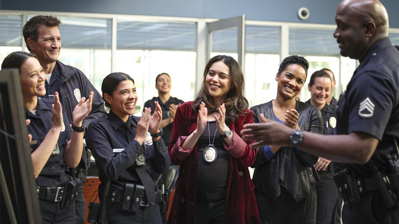 Members of the LAPD clapping together