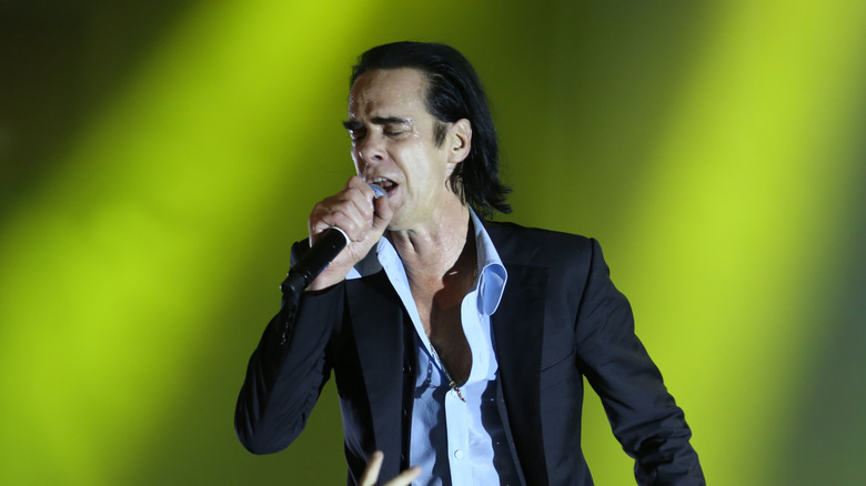 Nick Cave singing into microphone