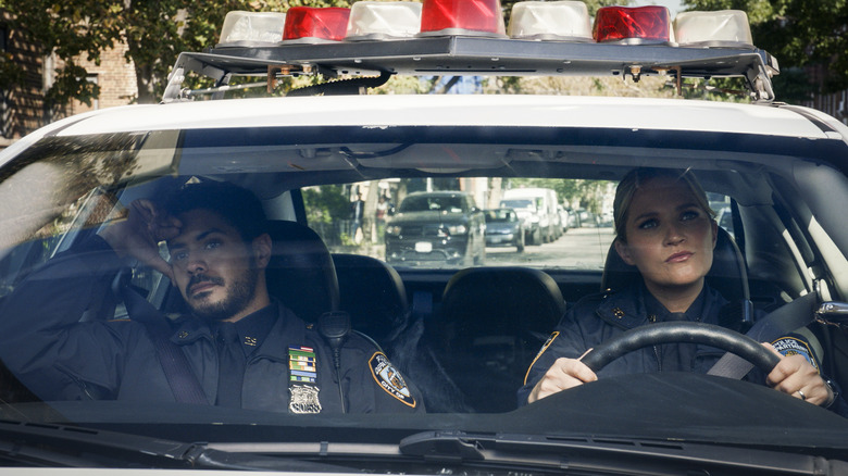 Officers Eddie Janko-Reagan and Luis Badillio in a cop car