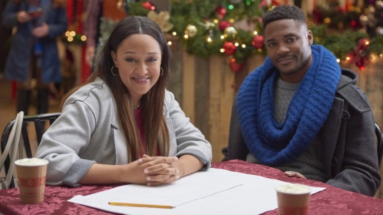 Tia Mowry-Hardrict and Duane Henry sit together