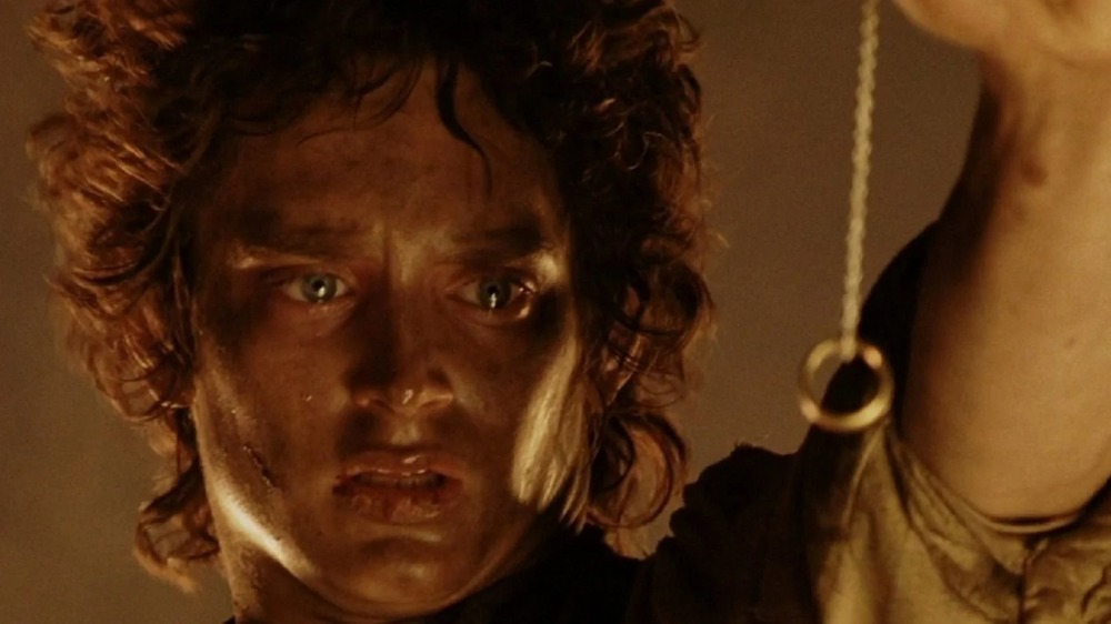 Frodo holds the One Ring