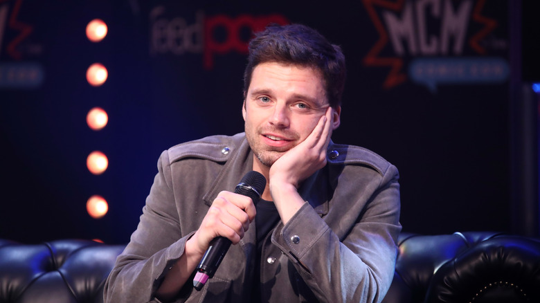 Sebastian Stan smiling on stage