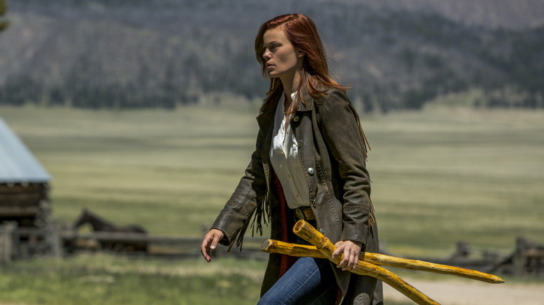 Cassidy Freeman Cady Longmire carrying sticks