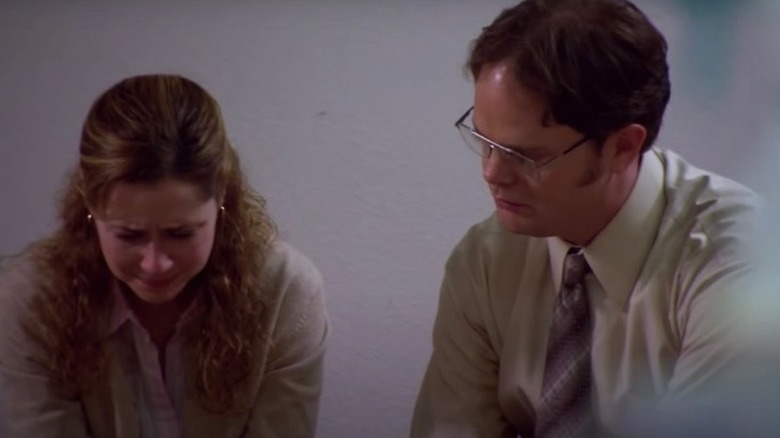 Pam crying as Dwight looks on