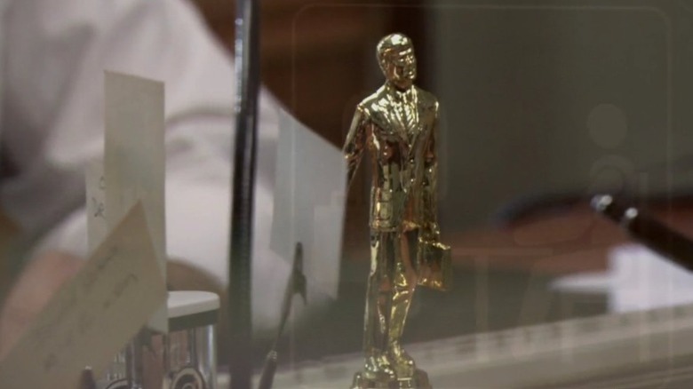 a golden "Dundie" trophy