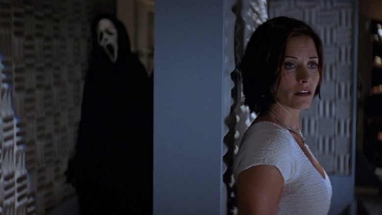 Ghost Face sneaking Courtney Cox