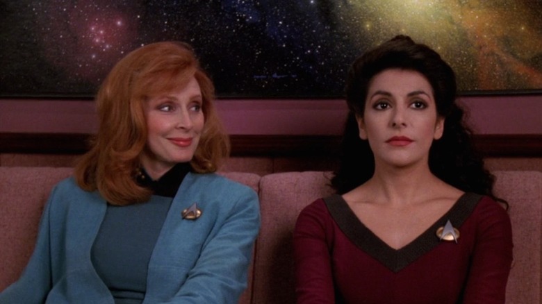 Beverly Crusher and Deanna Troi on couch in Star Trek: The Next Generation