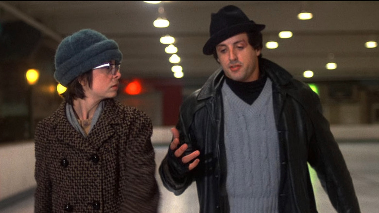 Rocky and Adrian in skate rink talking