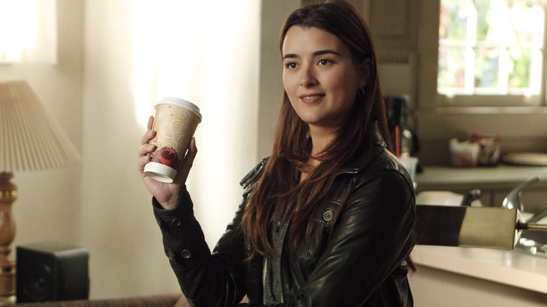 Ziva David holding coffee cup