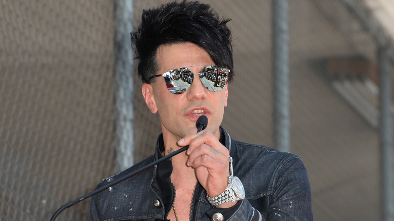 Criss Angel talking at a microphone