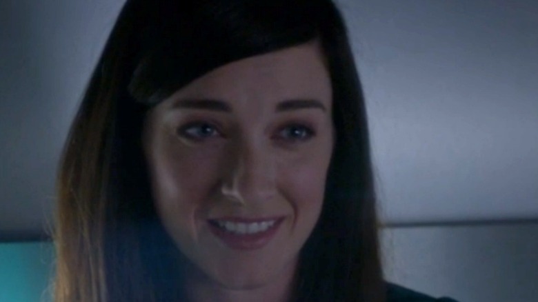 Delilah smiling after McGee proposes