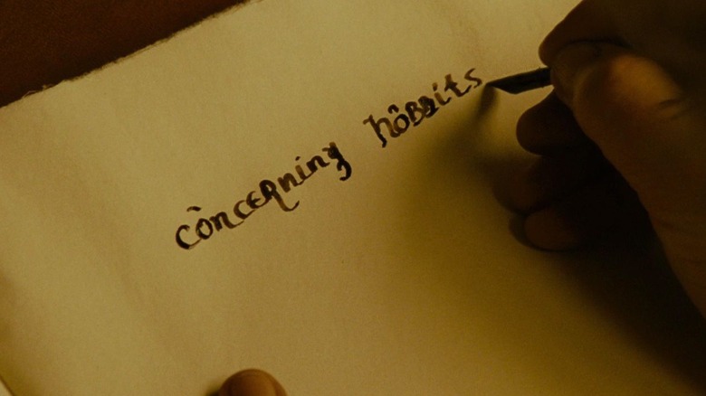 Bilbo writing "Concerning Hobbits"