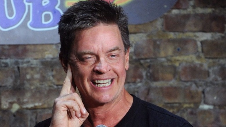 Jim Breuer holding mic