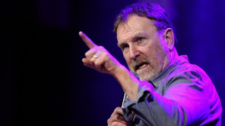 Colin Quinn pointing while doing standup