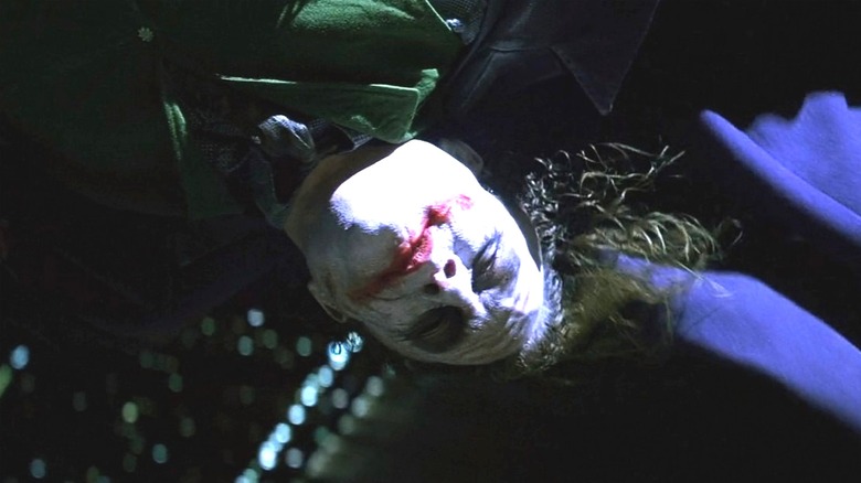 The Joker hangs upside down