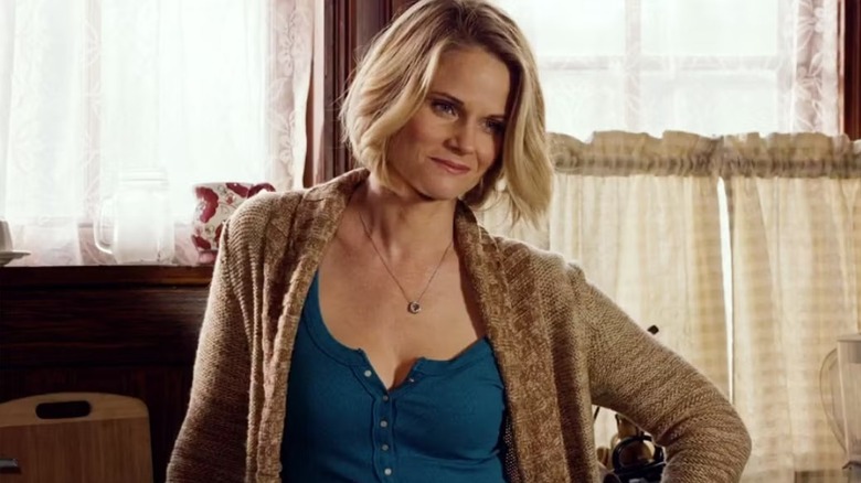 Ava leaning against a counter, smiling, in "Justified."