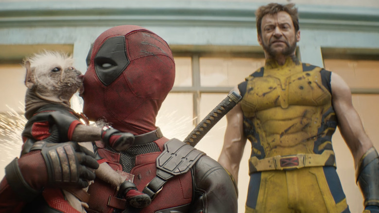 Wolverine stares at Deadpool and puppy