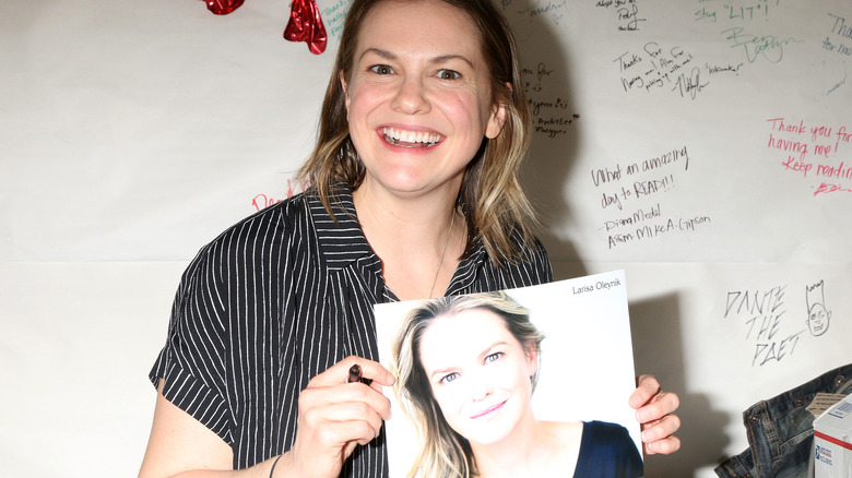 Larisa Oleynik holding headshot