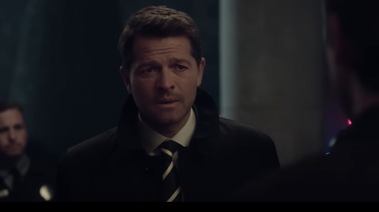 Misha Collins looking apologetic as Harvey Dent in the trailer for Gotham Knights