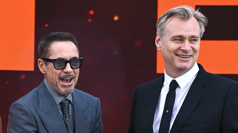 Robert Downey Jr. and Christopher Nolan smiling