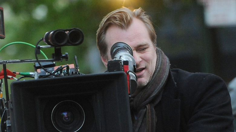 Christopher Nolan looking through camera