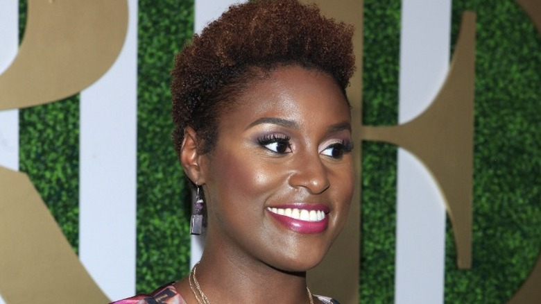 Issa Rae looking off to the side