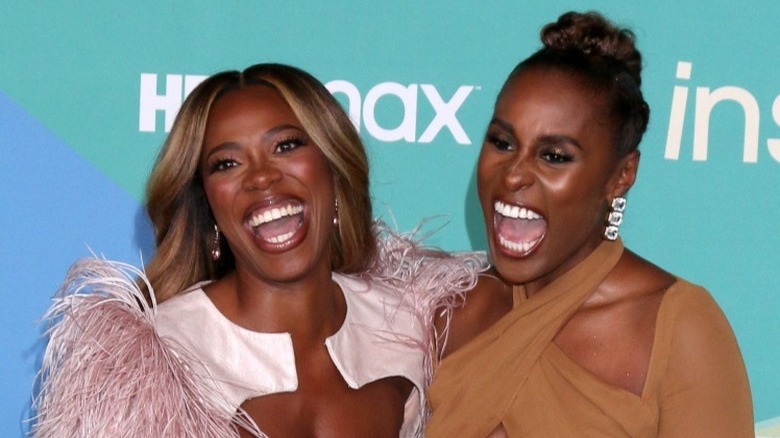 Issa Rae and Yvonne Orji laughing